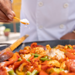 msg seasoning added to meal cooking in pan